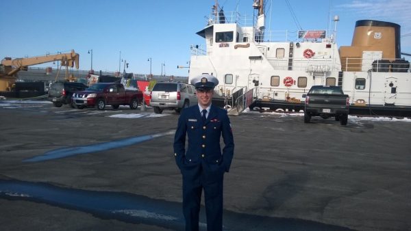 Ryan Wiley by a Coast Guard Ship