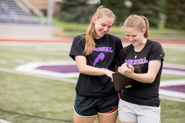 Sophomores Lindsey Frazier and Sarah Carvo look at notes for their summer research project