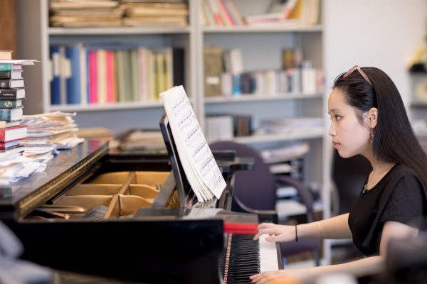 Giselle Nguyen playing the piano