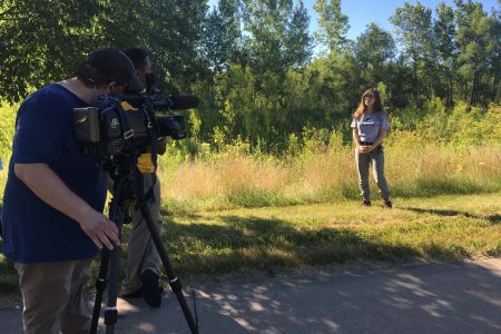 Student getting interviewed on camera by the news