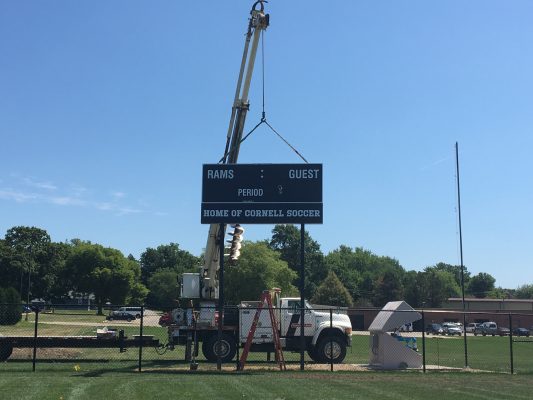 Photo of crane holding up new scoreboard