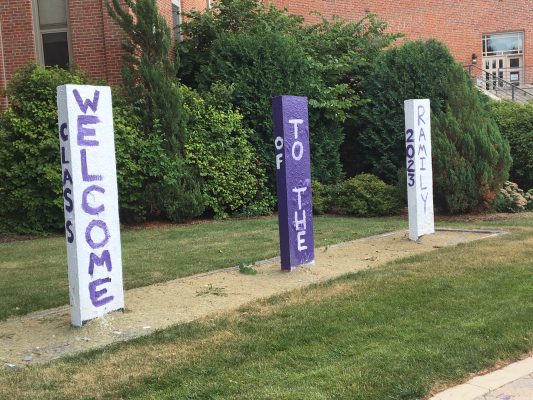 Three stone kiosks say "Welcome to the Ramily"