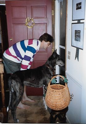 Tim Wynes and his dog Hayley hand out treats to trick-or-treaters. 