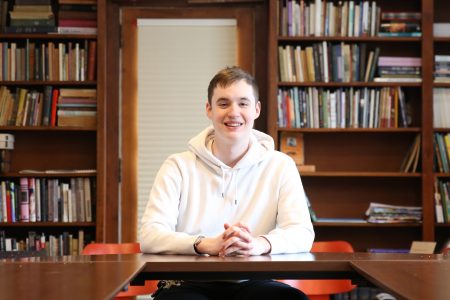 Sophomore Connor Kenney inside Van Etten-Lacey House.