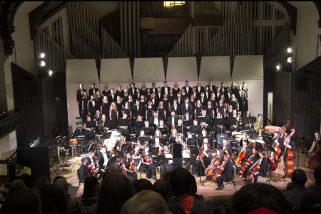 orchestra and choir combined concert on stage