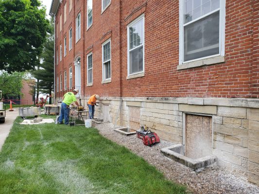 Working on the stones on College Hall