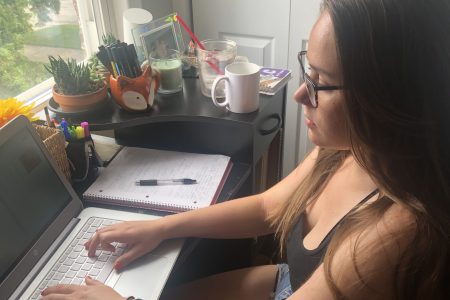 Student sitting at laptop working