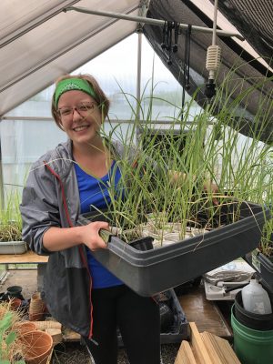 Kat Armstrong holding plants