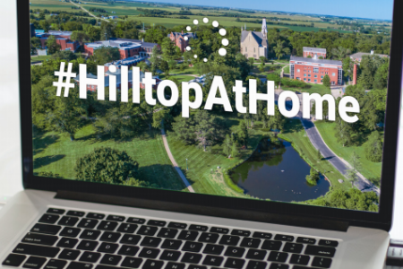 laptop with #HilltopAtHome on the screen