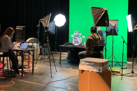 Maggie McClellan (left), Camille Wong, and Regen Kuker preparing for a puppet video shoot