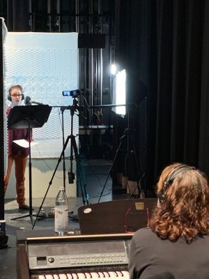 enna Makkawy records her vocals in makeshift recording booth, while musical director Janelle Lauer listens on