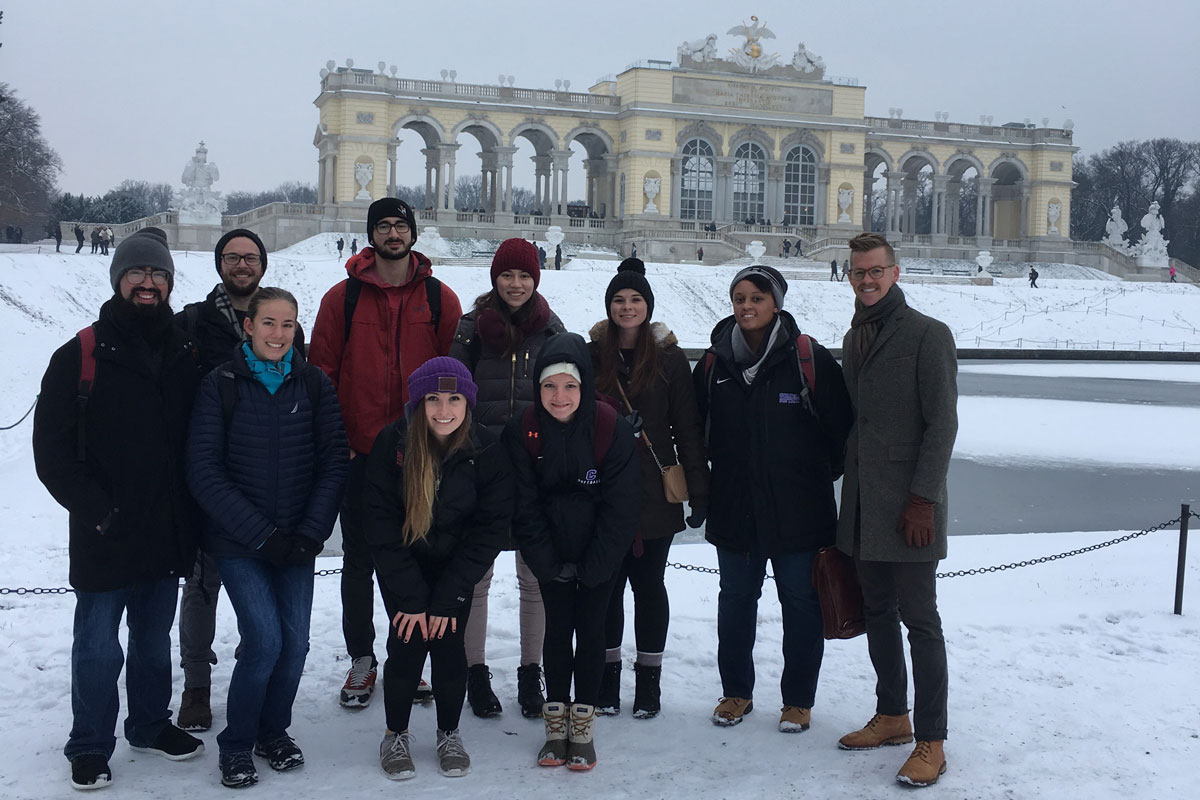 Professor Tyler Carrington (right) with his class at the Schönbrunn Palace in Vienna.