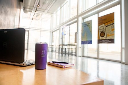 laptop and mug in the lobby outside Kimmel theatre