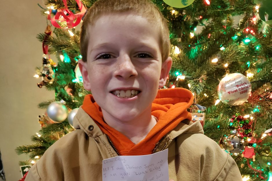 Third grade buddy Cody Bock with a letter from his Cornell buddy