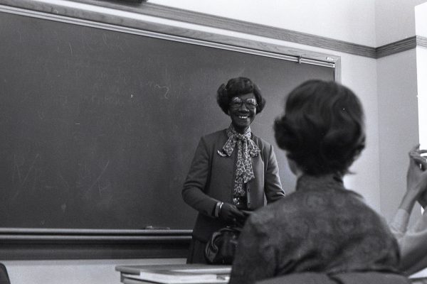 While on campus Jan. 21, 1982, for a King Chapel lecture on “Setting National Priorities,” Shirley Chisholm speaks to a group, possibly a politics class and guests, in South Hall. 