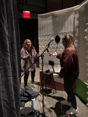 Musical Director, Janelle Lauer (left) is coaching Sophia Mitchell during a vocal recording session. (Photo by: Maggie McClellan.) 