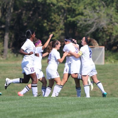 Cornell women’s soccer players share their enthusiasm after scoring a goal during a home match in 2015.