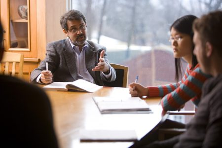 Professor of Economics and Business A'amer Farooqi teaching Cornell students.