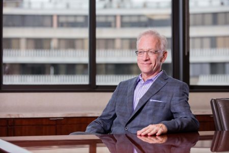 photo of Scott Simmer at an office desk