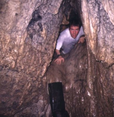 Denniston coming out of the main chamber of a Nepalese cave in 1995