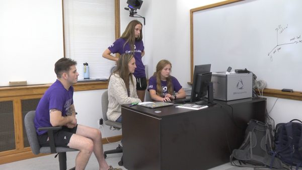 Associate Professor of Kinesiology Krisi Meyer (center) works with (from left) Quinten Howe, Rory Light, and Sydney Hancox.