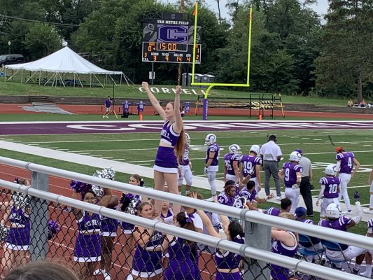 cheerleaders cheering on the Rams during the first football game of the season