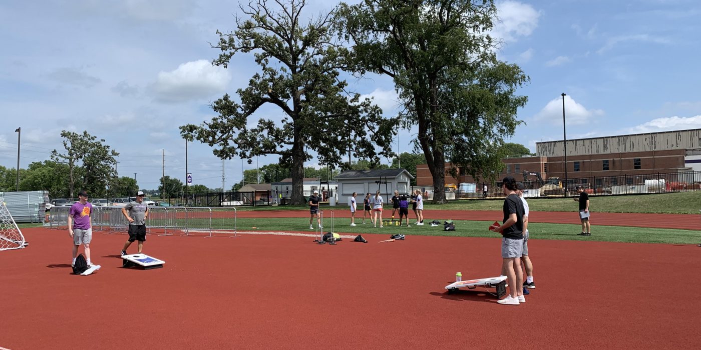 Students play bags during Field Day