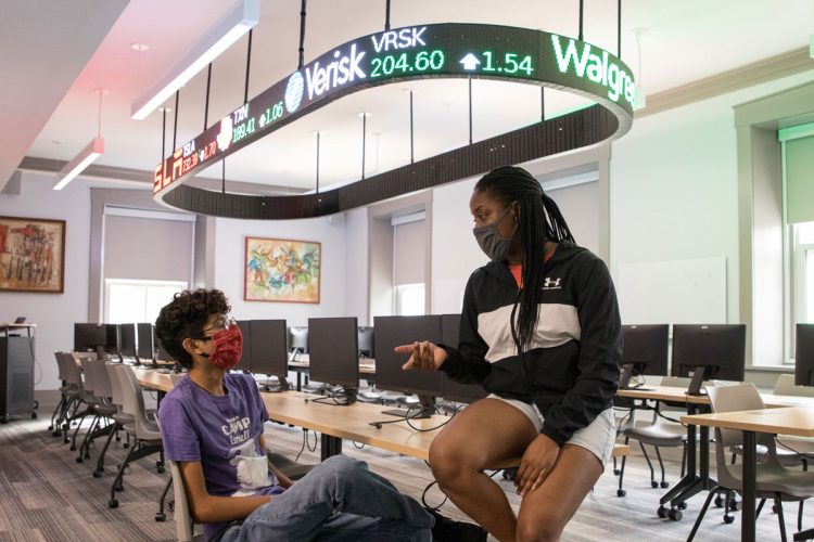 Students consult in the Cell Finance Lab in the renovated McLennan College Hall.