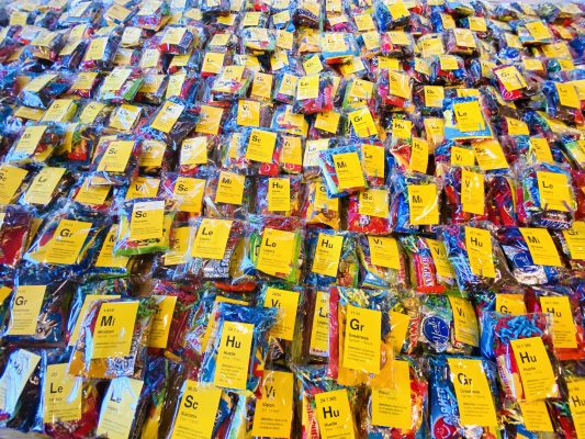 Bags of brightly colored candy on the table