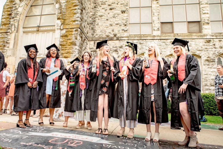 Members of Phi Omega celebrate at the squares following their 2019 Commencement