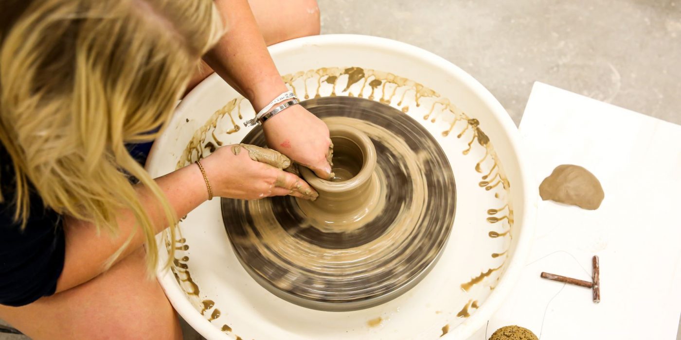 Student working on pottery