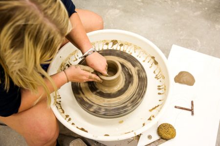 Student working on pottery