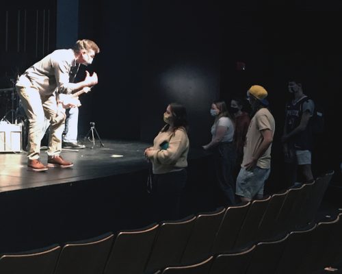 Student approach the stage to ask the speaker questions