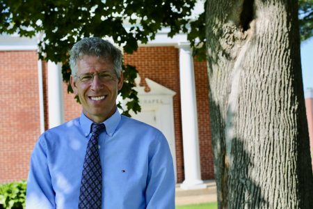 Jonathan Brand 2021 headshot on campus in front of Allee Chapel