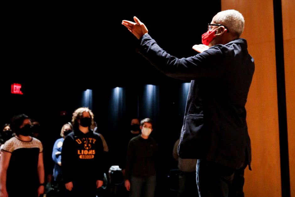 Charles Thomas Hayes '77 rehearses singers at Cornell College in February