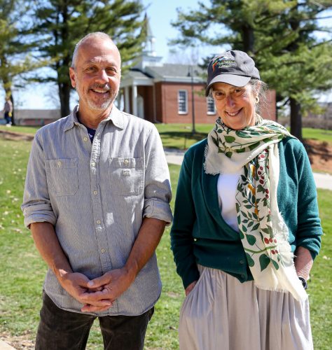 Professors Tony Plaut ’78 and Marty Condon stand side-by-side with Allee Chapel behind them. They taught Cornell students for a combined 56 years.