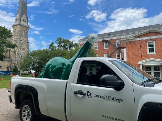 The Sinclair Dinosaur in the back of a Cornell College facilities truck