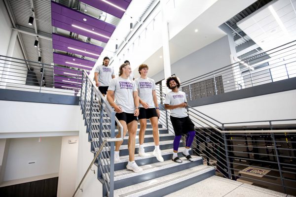 Football players going down the steps