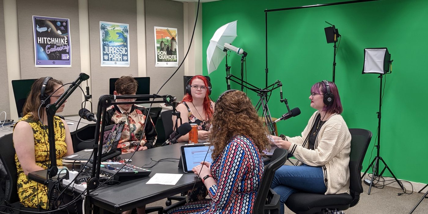 Students work on the podcast “Exposing Your High School Reading List” in the Academic Technology Studio.