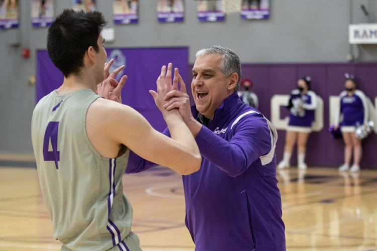 Men’s Basketball Head Coach Dave Schlabaugh interacts with forward Marcus Quirk ’22.