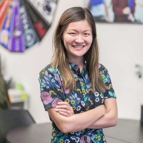 Lisa Chen '12 stands in a classroom