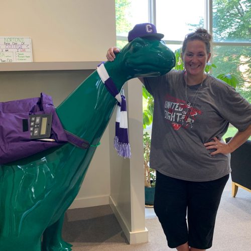 Mandy Landuyt ’99 poses with Norton in Cole Library after moving her daughter in as a new student.