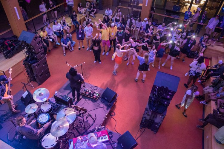 James Tutson and the Rollback (featuring Professor of History and German Studies Tyler Carrington on drums) performs on the OC in 2022 to a happy crowd of dancing students.