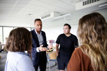 Linn County Supervisor Stacey Walker talks with Nick Schwartz , Assistant Professor of American Politics Megan Goldberg, and Savannah Sheffler