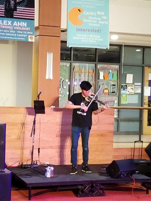 A violinist on stage performing