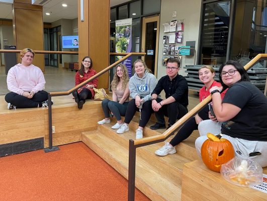 Members of the PAAC team posing for a photo after their pumpkin-carving event.