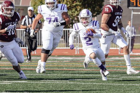 Daniel Abesames-Hammer ’24 carries the ball for the Rams. Head Football Coach Dan Pifer said Abesames-Hammer is likely the smallest college football player who’s actually played in a game.