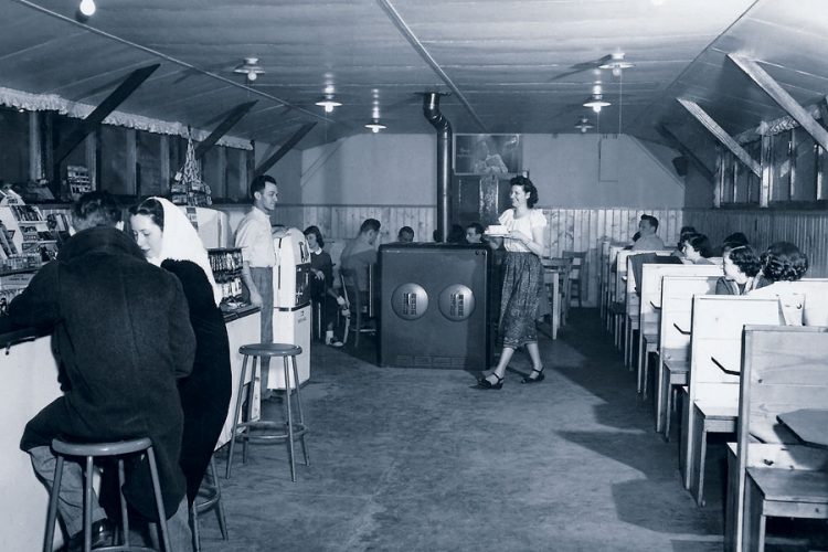 George and Alice Brown ran Cornell’s first Cole Bin, which opened in 1945. A new Cole Bin opened on campus in 1947, and the Browns ran George’s Grill from 1949–1952 just off campus near Brackett House. This image shows the Browns in George’s Grill. Image by Helga Koch Konopacki ’50.