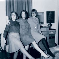 Three Class of '66 women classmates kick up their feet in their Pfeiffer dorm room