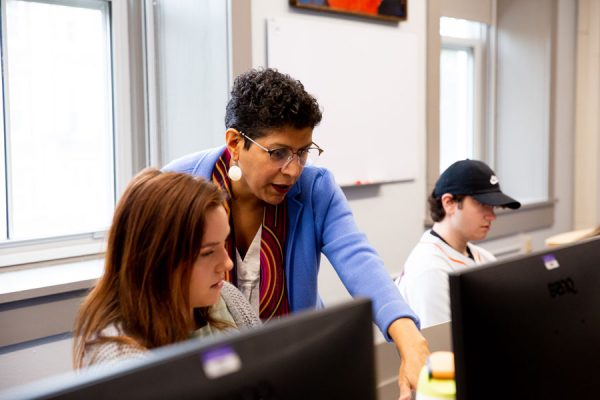 Professor Hejeebu and her students discuss relationships (part to a whole) and rankings in McLennan College Hall’s Cell Finance Lab.